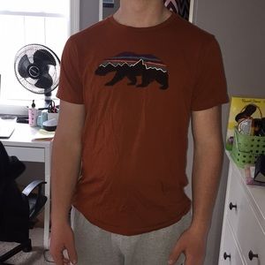 Men’s orange Patagonia shirt size M